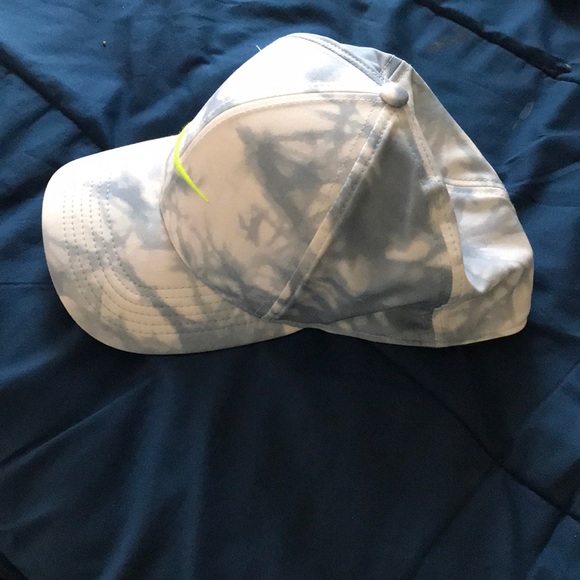 Blue and white Nike hat with lime green checks